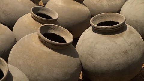 Pots arranged side by side to each other Stock Footage 99915477