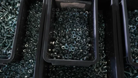 Pots full of different kinds of screws and hexagon nuts nicely divided. Stock Footage 227728811