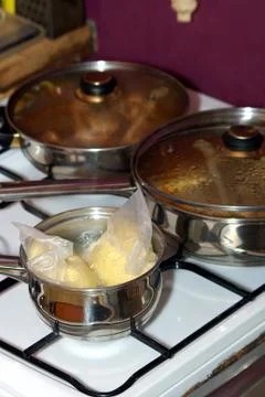 Pots on gas Stock Photos