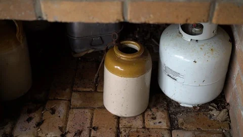 Pots under brick table Stock Footage