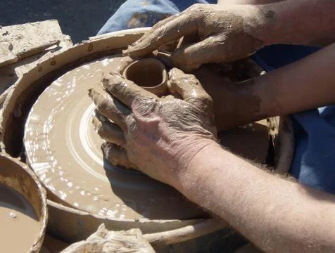 Potter and apprentice Hands of master potter and apprentice on potter s wh... Stock Photos