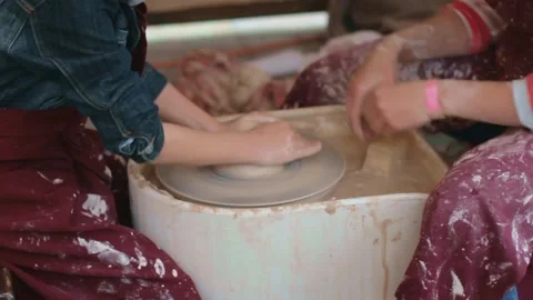 Potter and his apprentice make a pot out of clay. 스톡 동영상 160268584