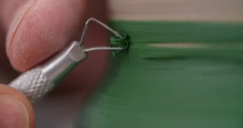 Potter carves a pattern on a rotating jug, potter's wheel at workshop, potter Stock Footage 151010049