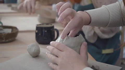 A potter crafts at the ceramic studio. Professional ceramist sculpts from clay. Video stock 222913773