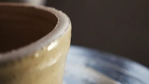 The potter creates clay pitchers Stock Footage 102306268
