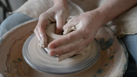 Potter doing the dishes on the circle Stock Footage 100606582