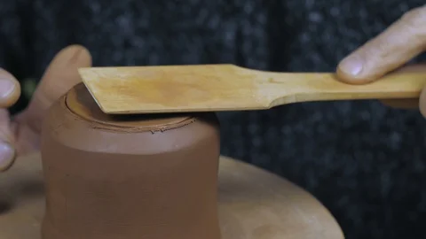 Potter fastens the lid of the kettle. Handmade clay teapot for tea ceremony. Stock Footage 120625996