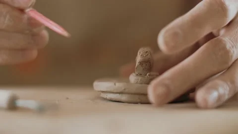 Potter hands close-up makes a clay product. Decorative tableware made of Stock Footage 152335447