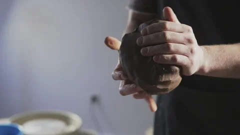 Potter hands kneads clay Video stock 105685853