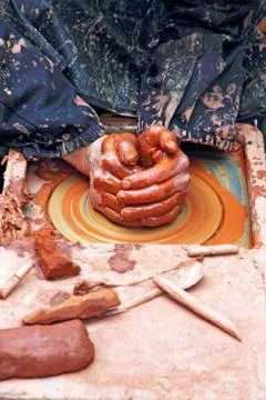 Potter hands. Stock Photos