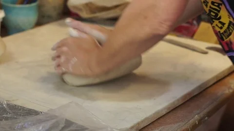 Potter kneading clay Stock Footage 71939719