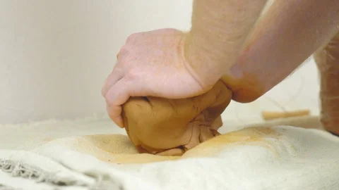 Potter kneads the clay Stock Footage 95976870