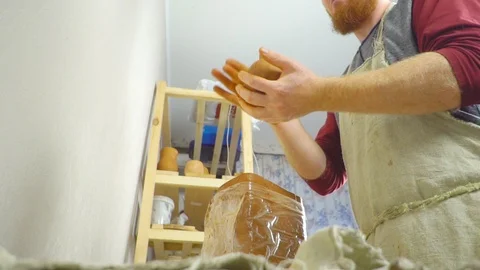 Potter kneads the clay Stock Footage 96286519