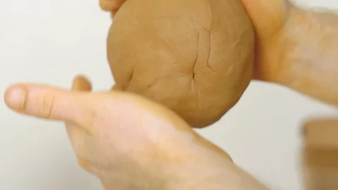 Potter kneads the clay Stock Footage 97330761