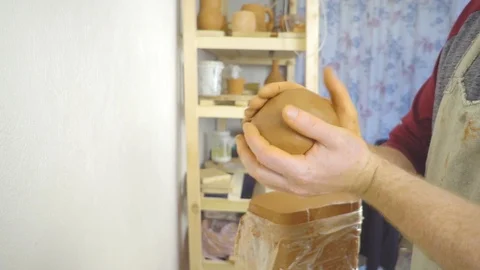 Potter kneads the clay Stock Footage 102649019