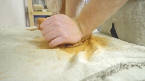 Potter kneads the clay Stock Footage 104280182
