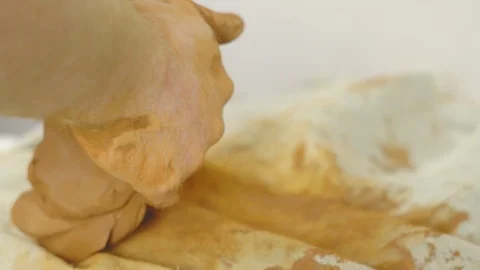 Potter kneads clay in a pottery workshop Stock Footage 115567281