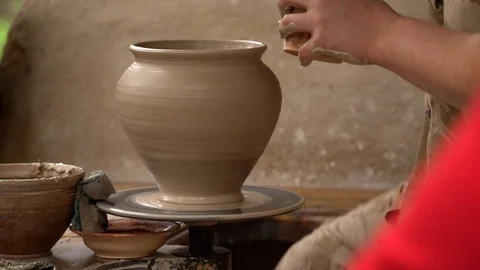 Potter makes and paints a pitcher Stock Footage 87472198