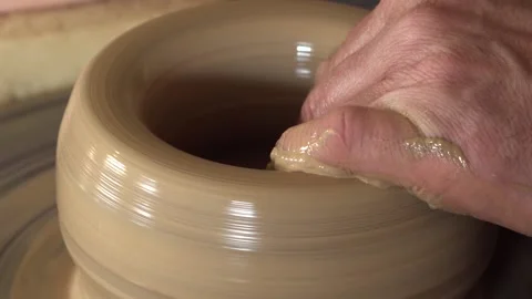 The potter makes a clay mug by hand Stock Footage 155702287