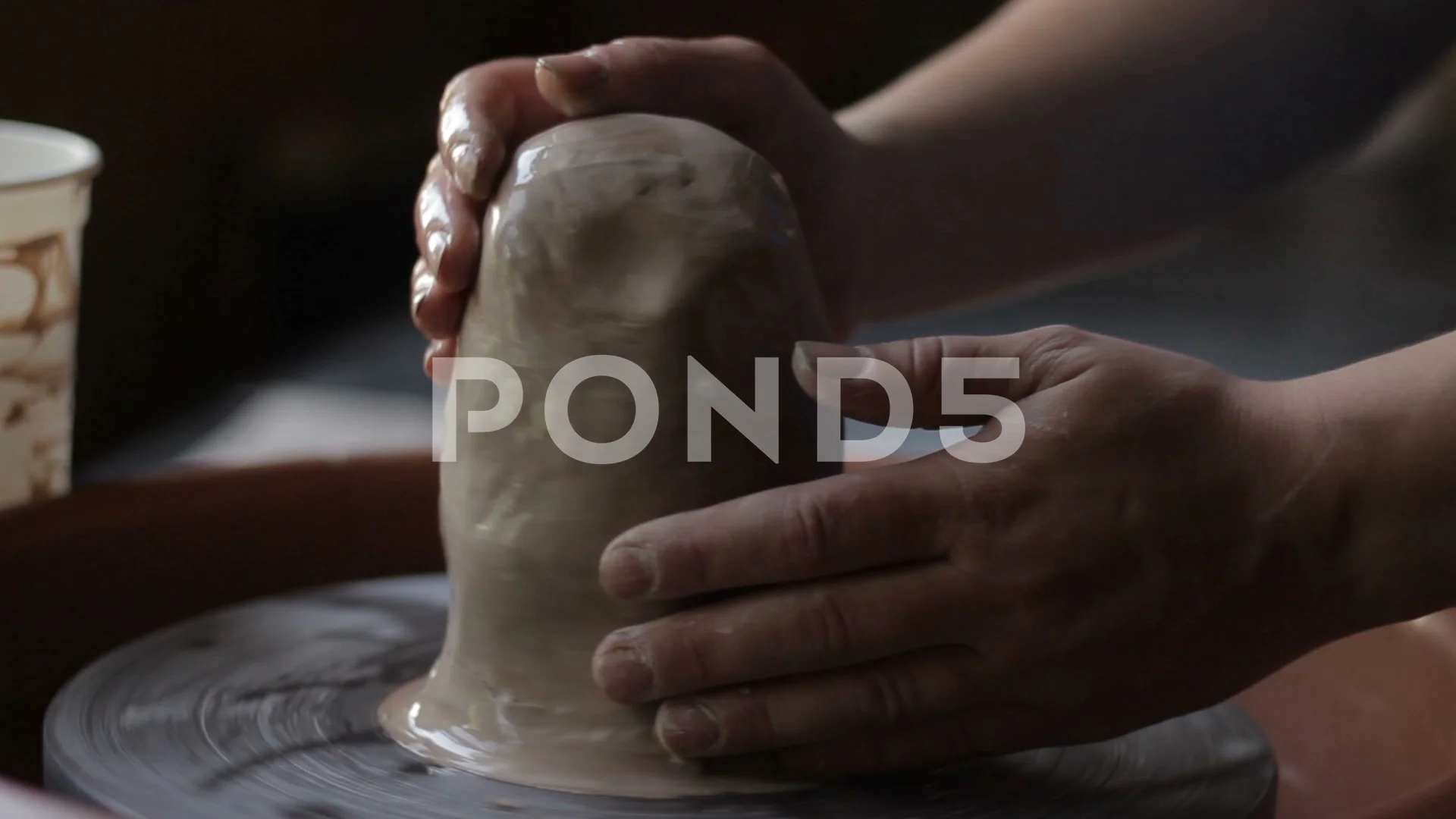 Artisan potter prepares material clay for pottery. Man knead clay