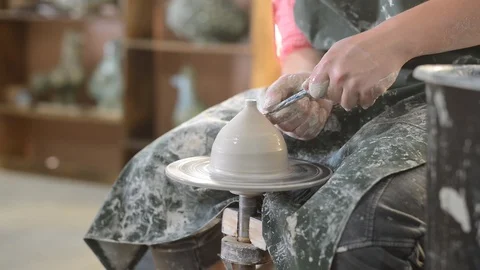 Potter makes earthenware on the circle Stock Footage 99746344