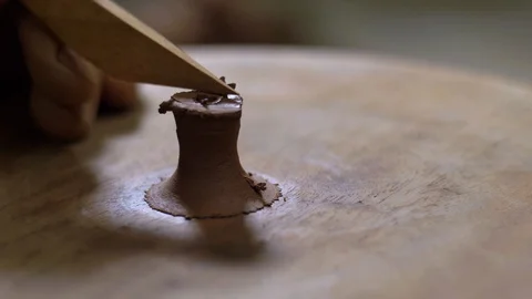 Potter makes a handle for a clay teapot from yixing clay. chinese tea ceremony Stock Footage 119537617