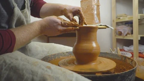 Potter makes a jug Stock Footage 95627443