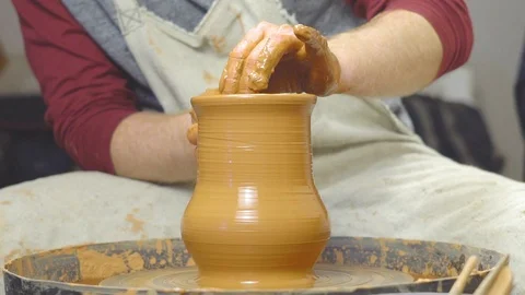 Potter makes a jug Stock Footage 97330302