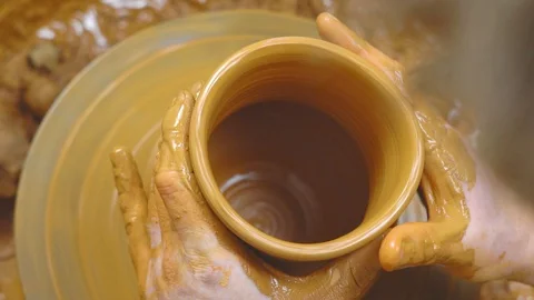 Potter makes a jug Stock Footage 98437900