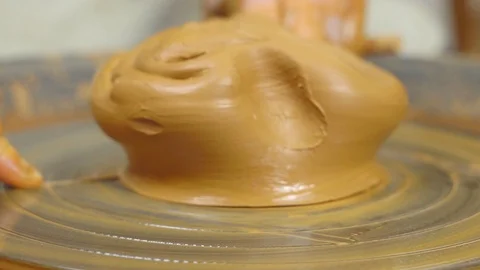 Potter makes a jug Stockbeeldmateriaal 98437988