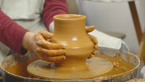 Potter makes a jug Stock Footage 99630179