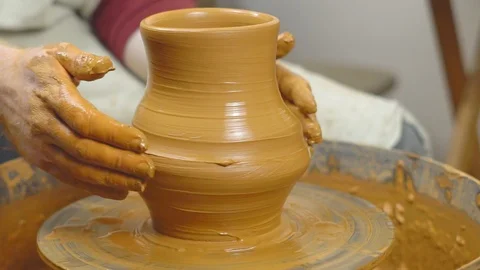 Potter makes a pitcher in the workshop Stock Footage 115567224