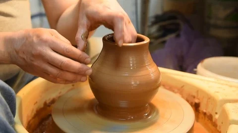Potter makes a pot of clay. Stock Footage 73706209