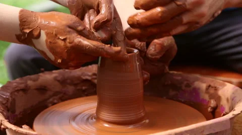 Potter makes pottery clay on a Potter's wheel Stock Footage 64309863