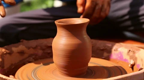 Potter makes pottery clay on a Potter's wheel Stock Footage 64309961