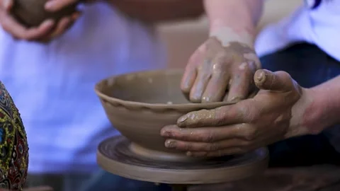 Potter making ceramic pot on the pottery wheel 動画素材 281053736