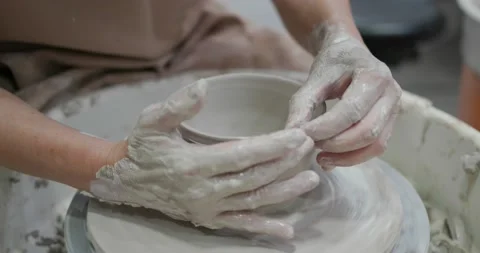 Potter making ceramic pot on the twisted pottery wheel Stock Footage 131903710