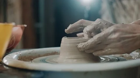 Potter making ceramic pot on the twisted pottery wheel. Woman making ceramic Stock Footage 151717542