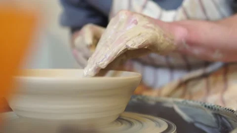 Potter making ceramic pot on the twisted pottery wheel.Potter at work, close up. Stock Footage 162811215