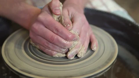 Potter making ceramic pot on the twisted pottery wheel.Potter at work, close up. Stock Footage 162811332