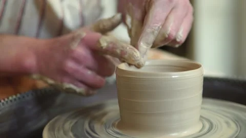 Potter making ceramic pot on the twisted pottery wheel.Potter at work, close up. Stock-Footage 162811502
