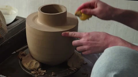 Potter making ceramic pot on the twisted pottery wheel.Potter at work, close up. Stock-Footage 162811542