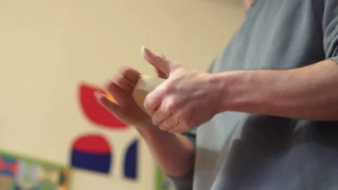 Potter making ceramic pot on the twisted pottery wheel.Mixing Potter Stock-Footage 162811606