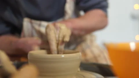 Potter making ceramic pot on the twisted pottery wheel.Potter at work, close up. Stock-Footage 162811697
