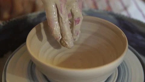 Potter making ceramic pot on the twisted pottery wheel.Potter at work, close up. Stock-Footage 162811859
