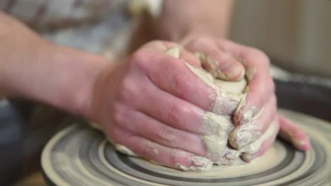 Potter making ceramic pot on the twisted pottery wheel.Potter at work, close up. Stock-Footage 162812096