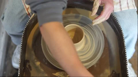 Potter making ceramic pot on the twisted pottery wheel.Potter at work, close up. Stock-Footage 162812483
