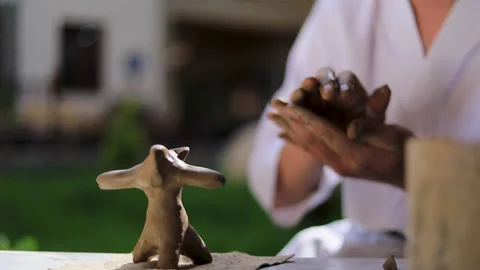 Potter making ceramic toy Video stock 281053739
