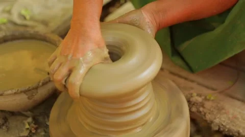 Potter making a pot in a pottery wheel, Burma Stock Footage 62923768