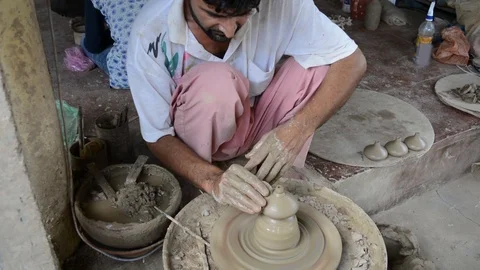 Potter making pot on wheel Stock Footage 102782865